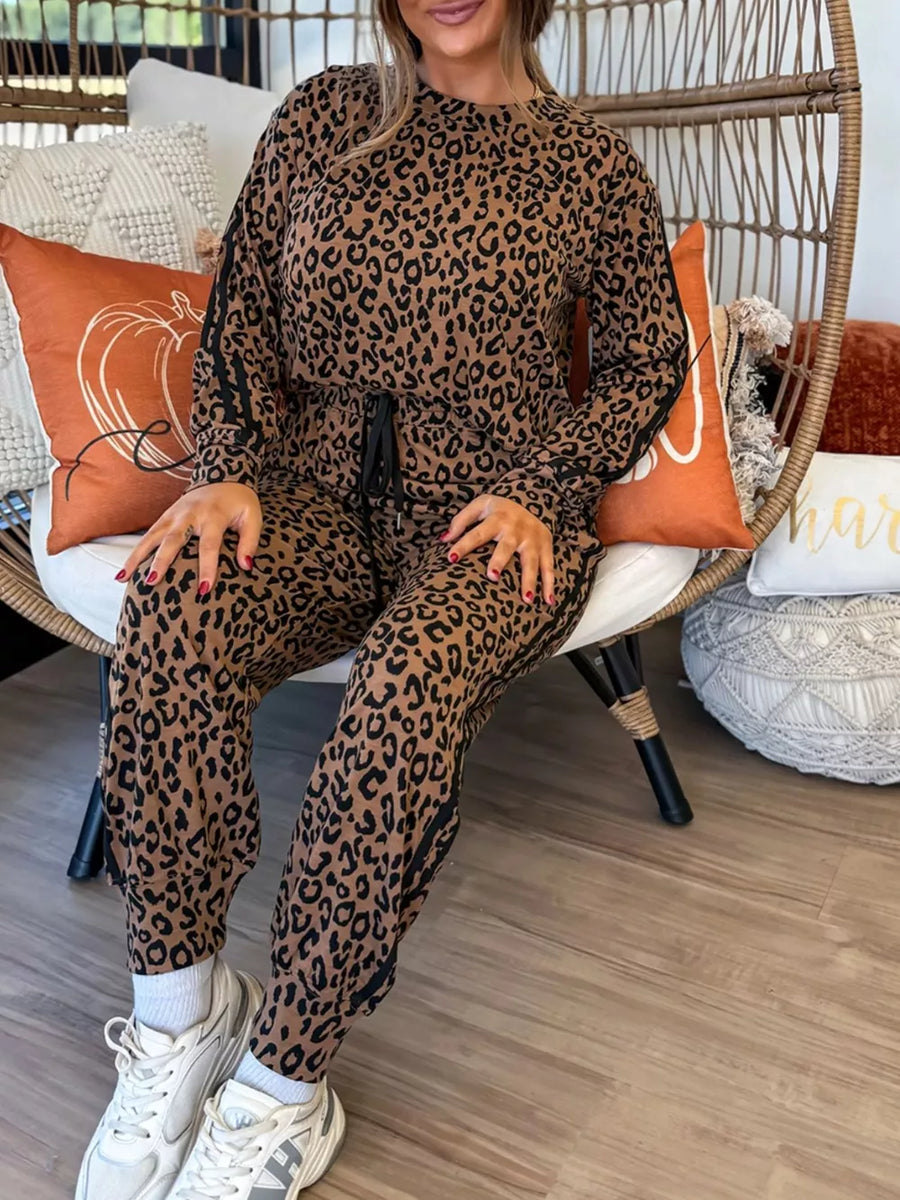 Leopard print joggers with drawstring waist and black side stripe detail.