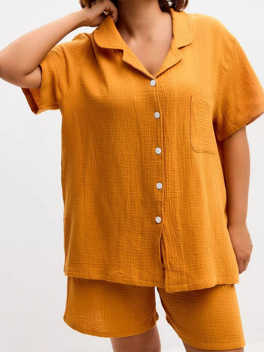Yellow cotton relaxed fit button-up shirt and shorts set with collared neckline and short sleeves.