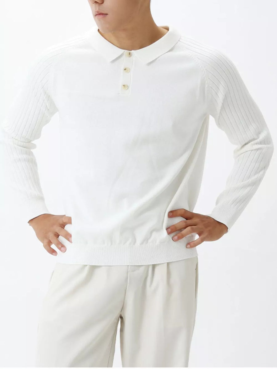 White cotton knit polo shirt with ribbed sleeves and a button placket.