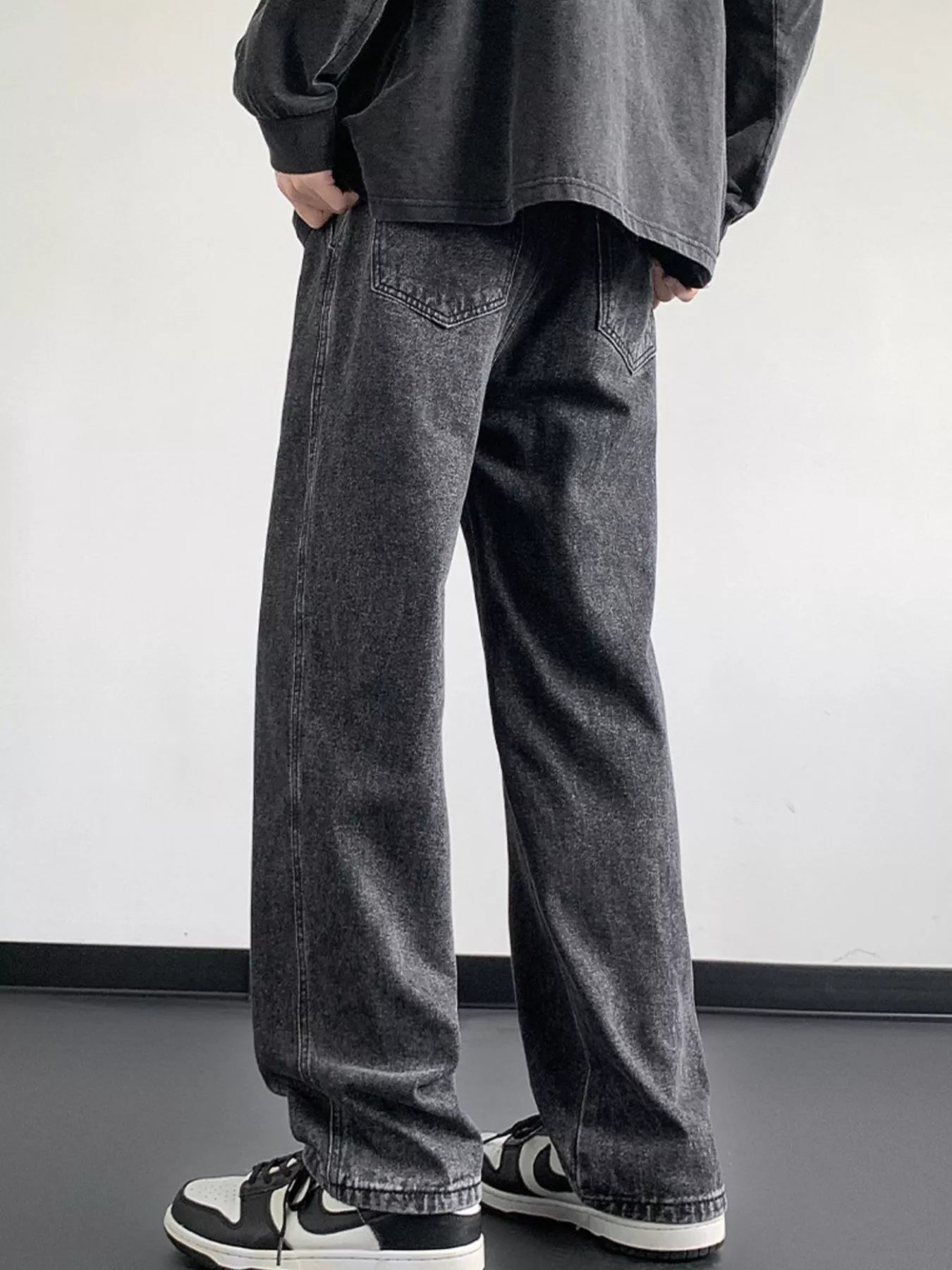 Oversized drawstring loose fit jeans in dark gray denim with a relaxed cut.