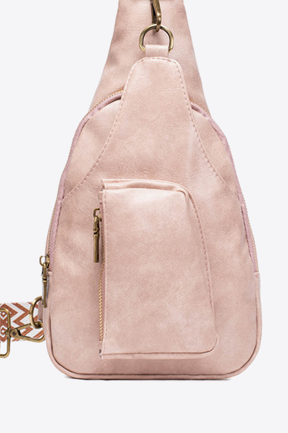 Pink textured sling bag with woven strap detail and front zip pocket.