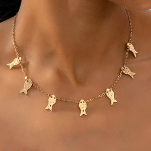 necklace in gold featuring charm details and delicate fit