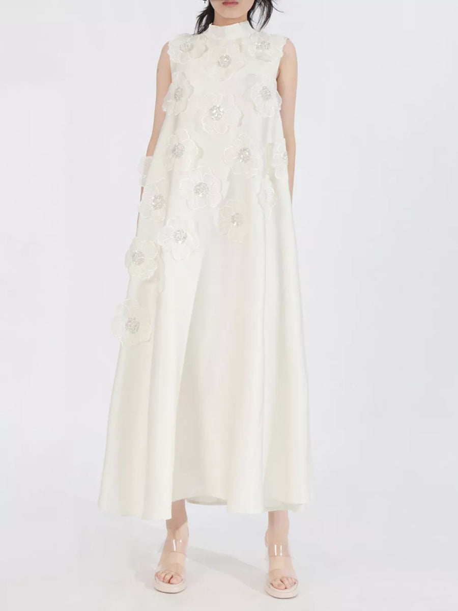 White sleeveless maxi dress with floral applique and sequin details, high neckline