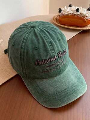 Army green washed baseball cap with embroidered text detail