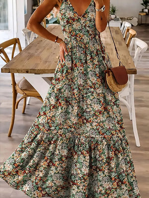 Floral tiered maxi dress with spaghetti straps in Black Forest, featuring a v-neck and ruffled hem.