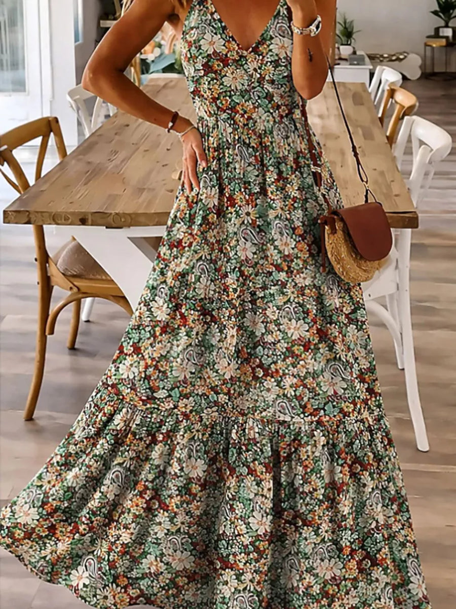 Floral tiered maxi dress with spaghetti straps in Black Forest, featuring a v-neck and ruffled hem.
