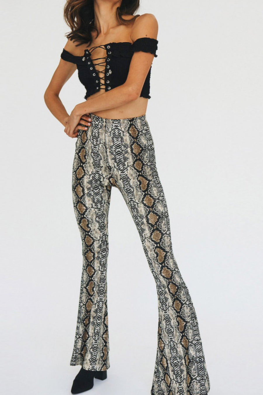 Bell-bottom pants in snakeskin print with a second-skin fit.