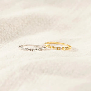 Silver and gold band rings with zirconia accents