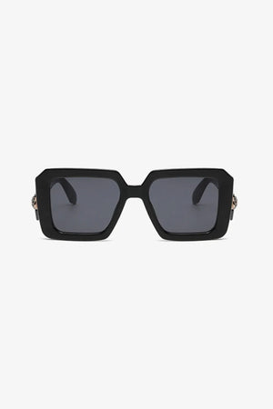 Black geometric facet sunglasses with embellished temples and dark lenses.