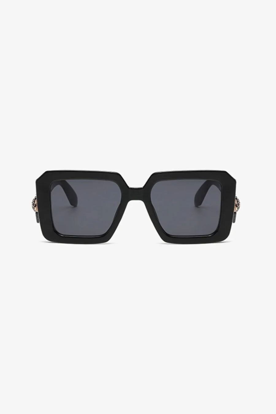 Black geometric facet sunglasses with embellished temples and dark lenses.