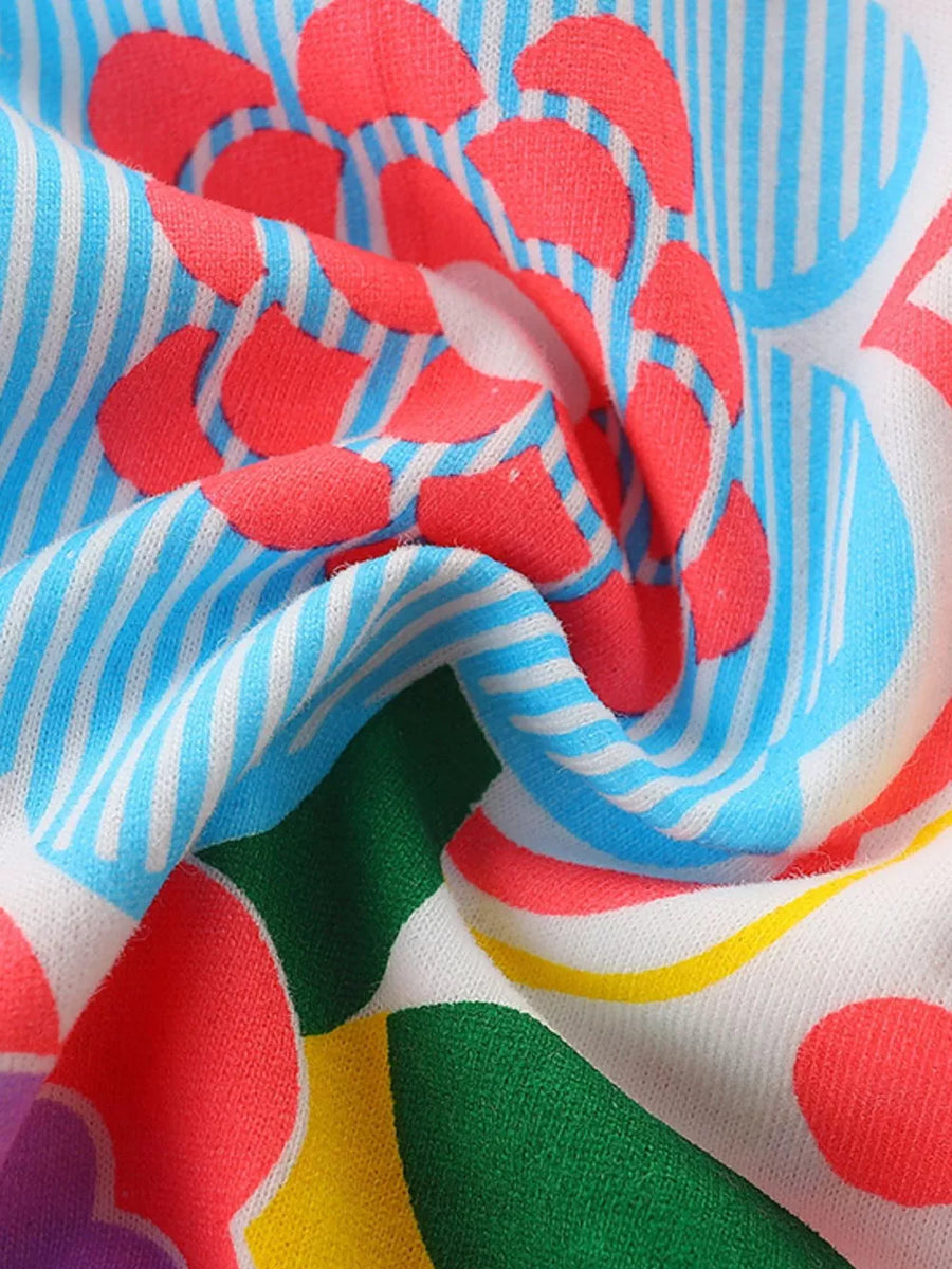 Toddler dress with cheerful floral print on striped fabric.