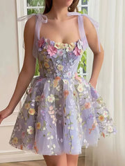 Floral embellished mini dress with tie straps and a sweetheart neckline in lavender tulle.