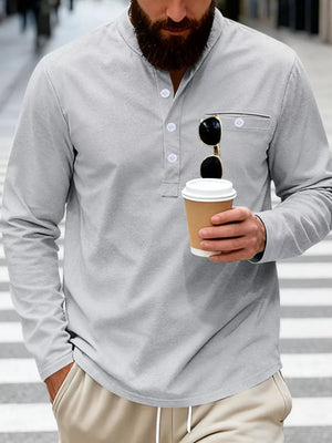 Light Gray long sleeve band collar shirt with button detail and chest pocket.