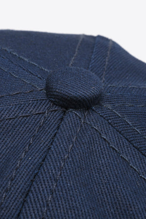 Navy cotton twill baseball cap with stitched panel detail and button top.
