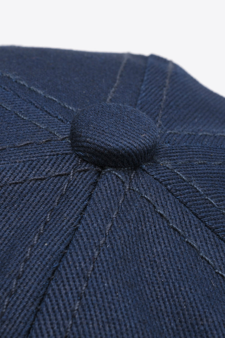 Navy cotton twill baseball cap with stitched panel detail and button top.