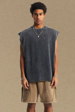 Raw edge muscle tank top in dark gray with a washed effect and raw hem.
