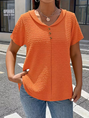 Orange textured short sleeve blouse with button detail and collared neckline.