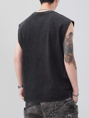 Black oversized cotton round-neck tank top with raw armholes, worn by a man.