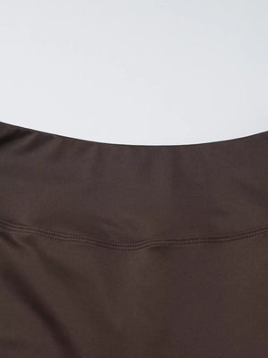Brown halter crop top and wide-leg pants set detail showing stitching.