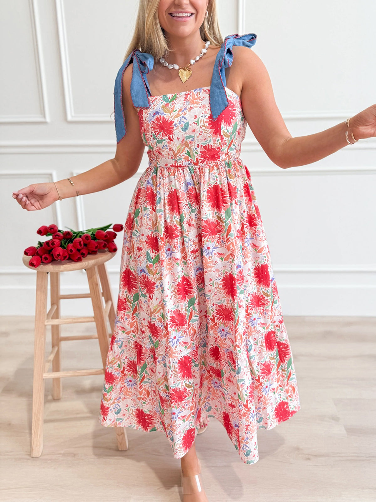 Floral print midi dress with tie-shoulder straps and a square neckline.