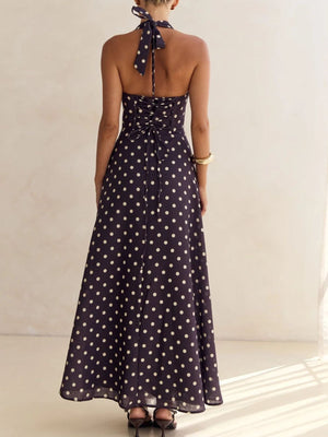 Navy polka dot halter maxi dress with lace-up back detail