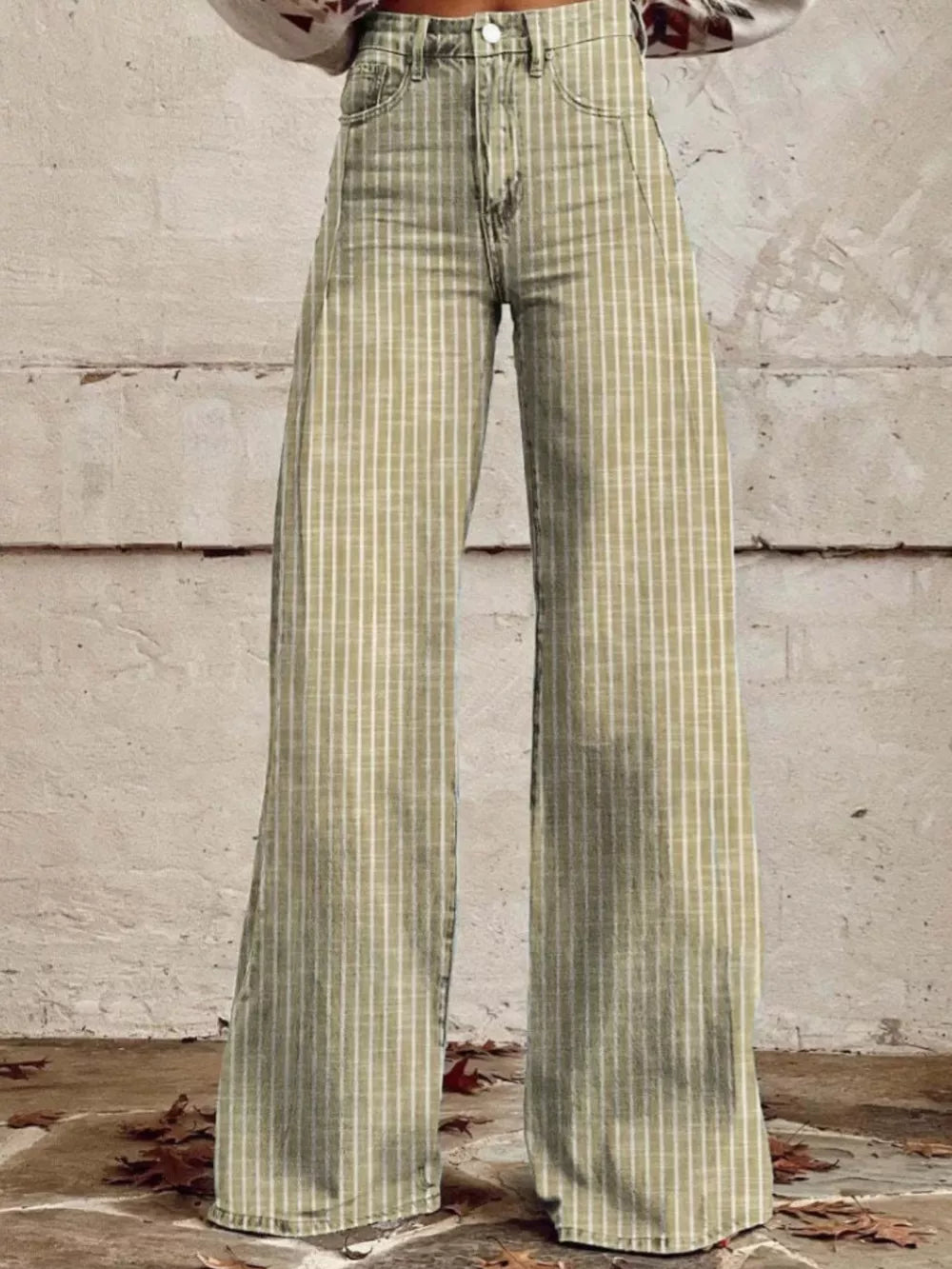High-waisted wide-leg jeans in green with white pinstripes and pockets.
