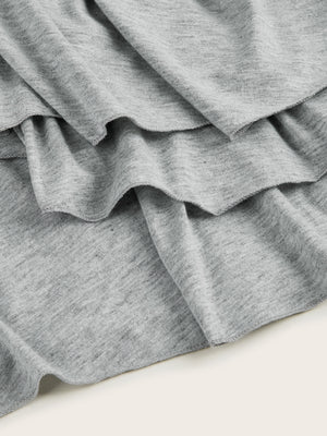 Light gray tiered midi dress with ruffled hem detail
