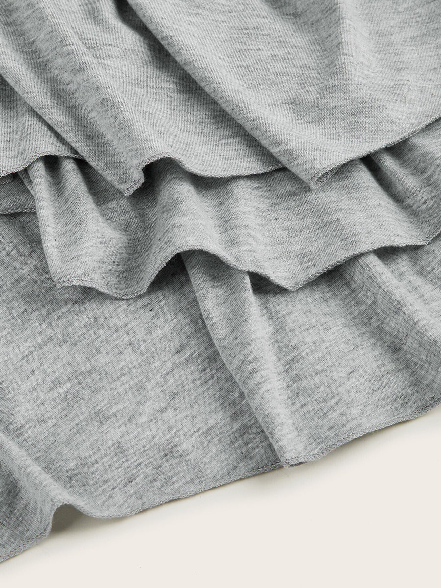 Light gray tiered midi dress with ruffled hem detail