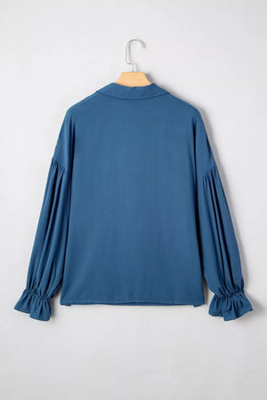 Blue long sleeve blouse with ruffled cuffs and gathered sleeves