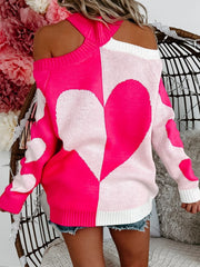 Hot pink and white acrylic sweater with open shoulders and a heart motif pattern.