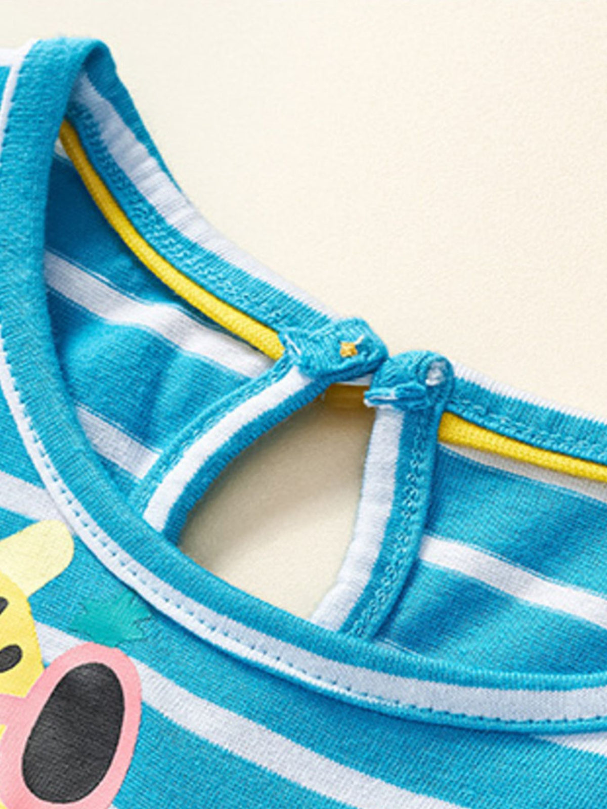 Toddler blue striped cotton dress with animal appliqué detail and button closure at back neck.