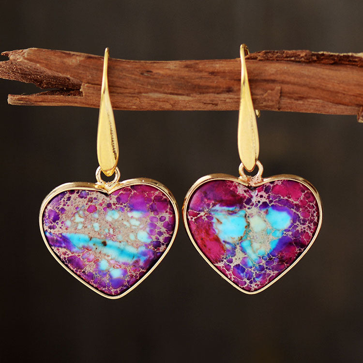 Heart-shaped jasper and gold dangle earrings in deep purple and blue tones.