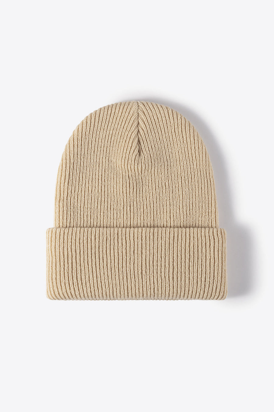 Beige ribbed knit beanie with a cuffed brim.