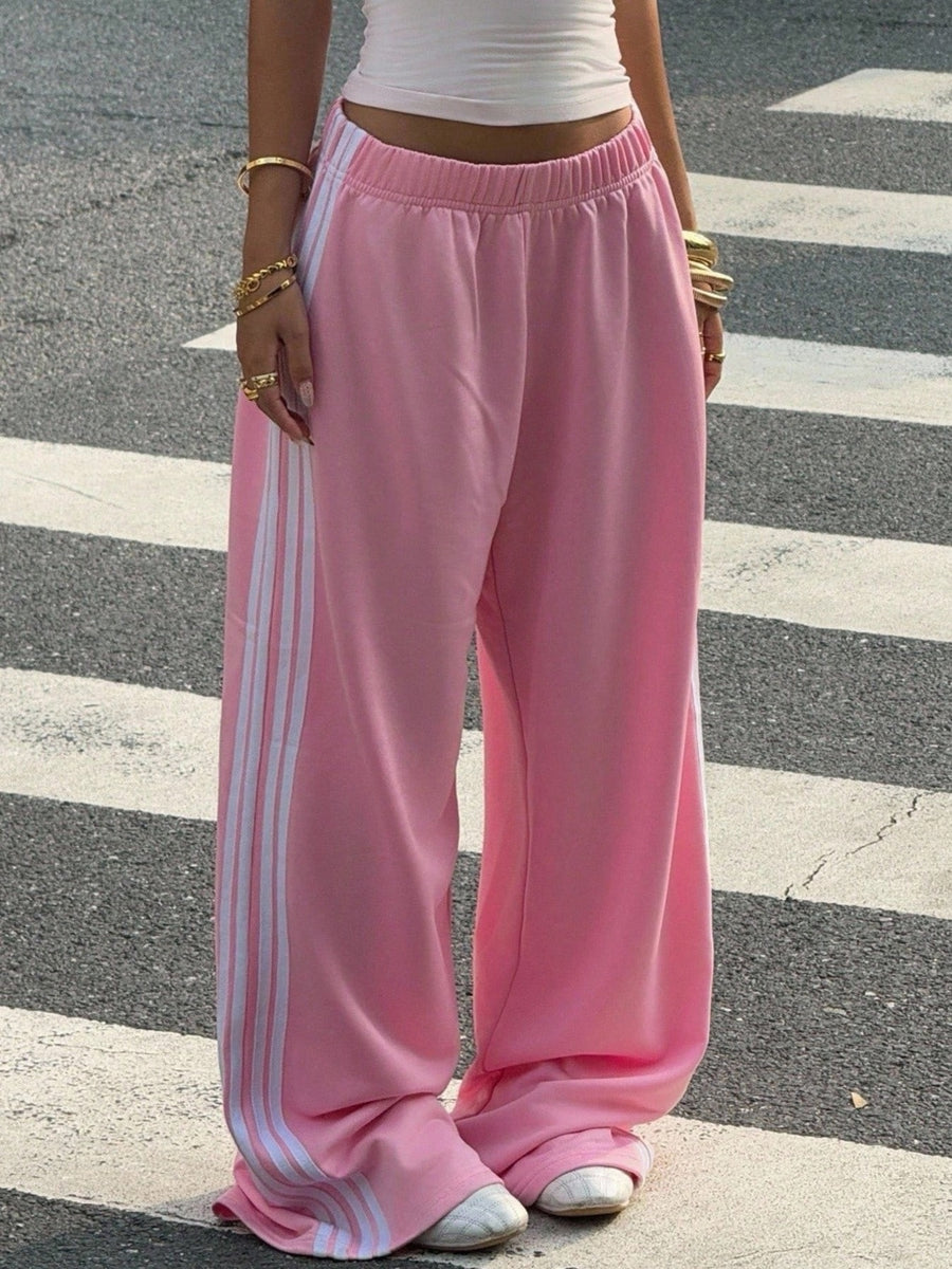 100% polyester Care instructions: Machine wash cold track pants in Gray with wide-leg silhouette