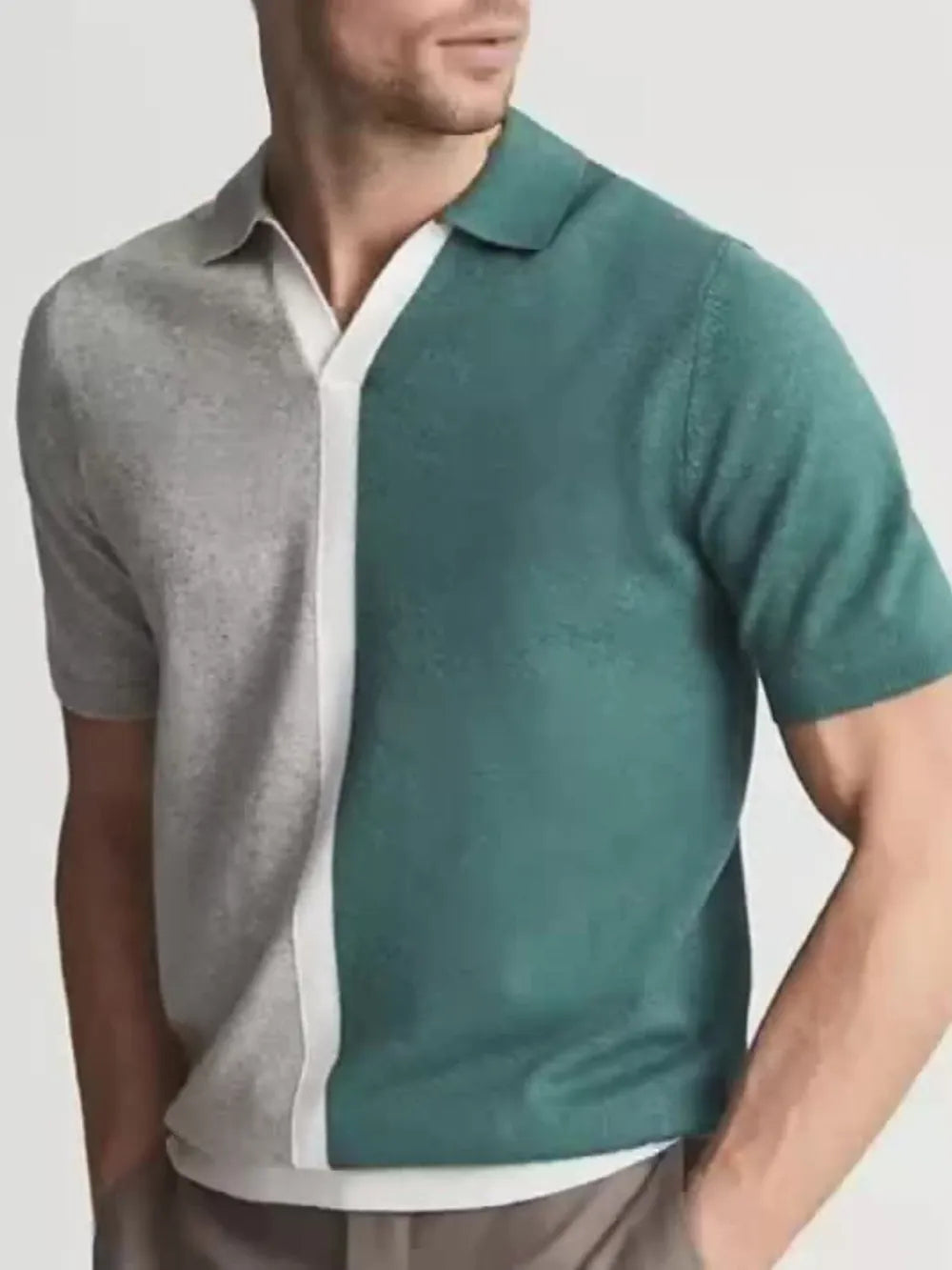 Colorblock polo shirt in dark green and grey with a white contrast placket and collar.