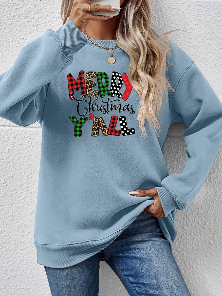 Misty Blue graphic sweatshirt with Merry Christmas Y'all text in mixed prints and patterns.