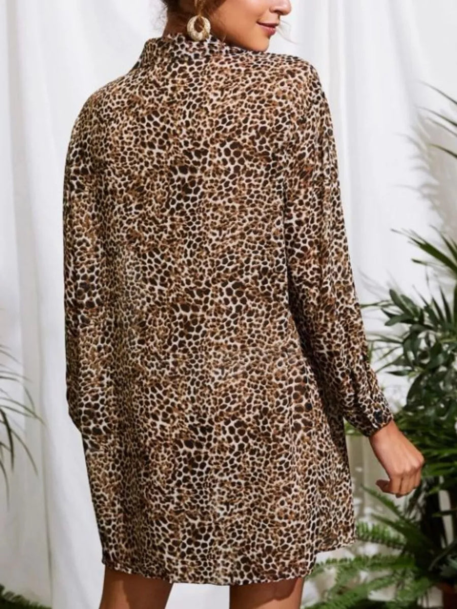 Leopard print oversized button-up shirt with long sleeves and a collared neckline.
