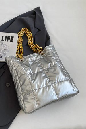 Silver quilted nylon tote bag with gold chain handle