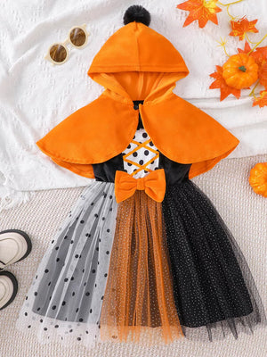 orange dress featuring mesh and polka dot