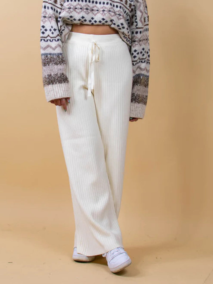 White ribbed knit palazzo trousers with drawstring waist and wide leg