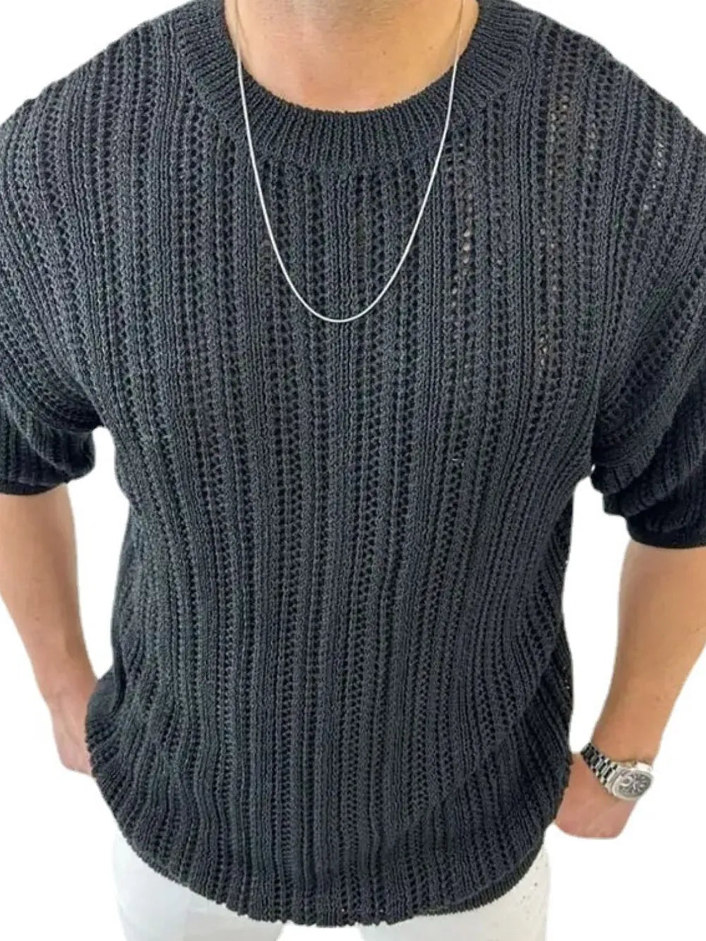 Black open-knit boxy crew neck sweater with short sleeves, acrylic material.