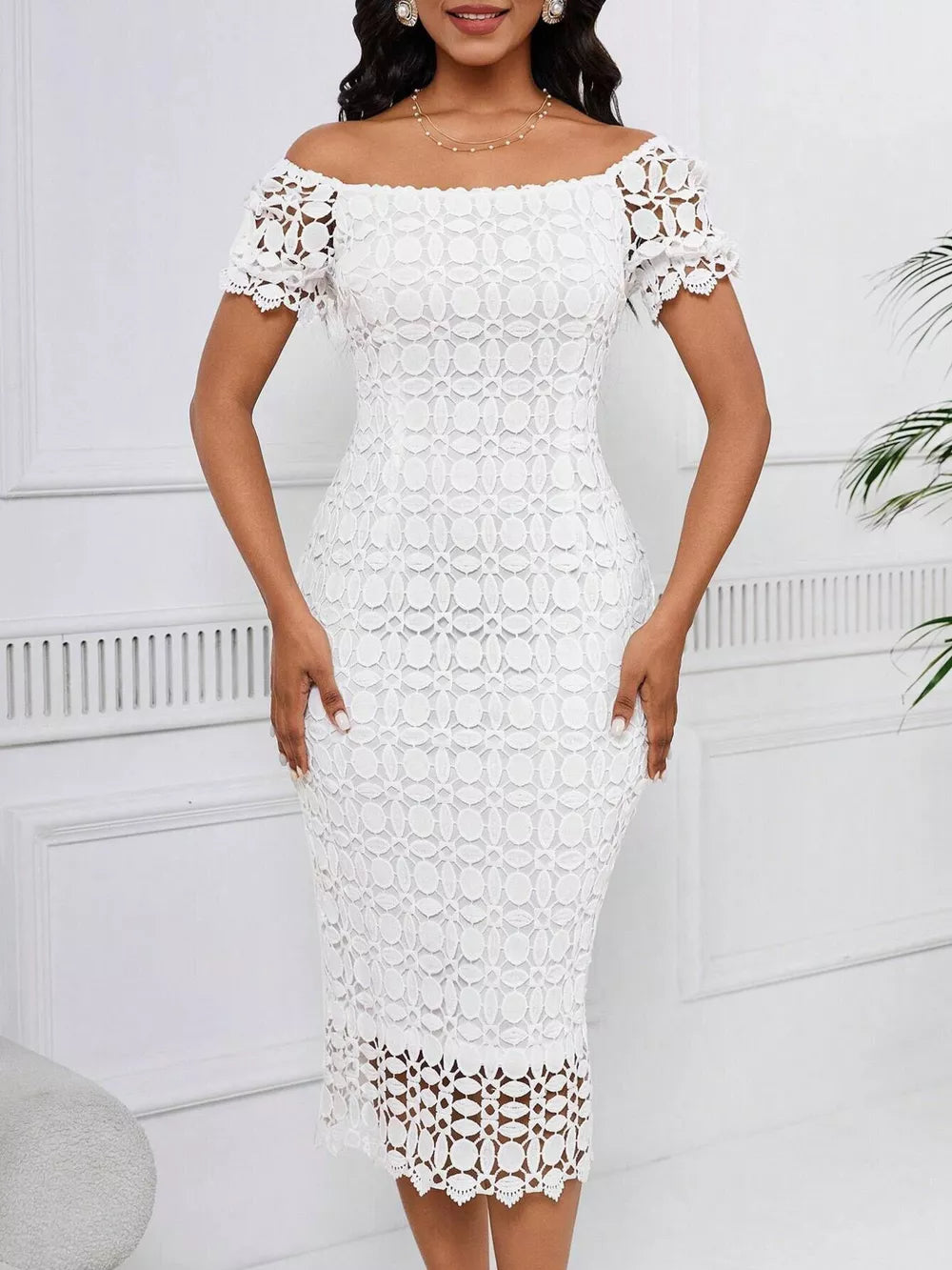 White lace off-the-shoulder midi dress with short sleeves and scalloped hem.