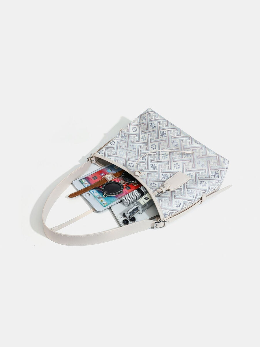 handbag featuring geometric in light blue with Polyester Imported Size &amp texture