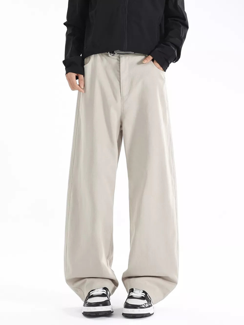 Men's beige wide-leg casual pants with a relaxed fit and belt detail.