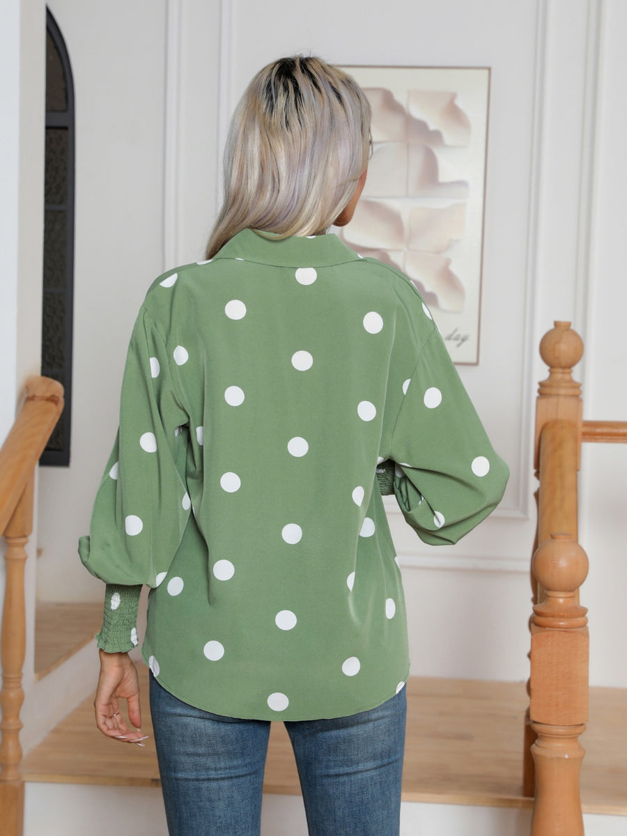 Light green polka dot blouse with shirred cuffs and balloon sleeves.