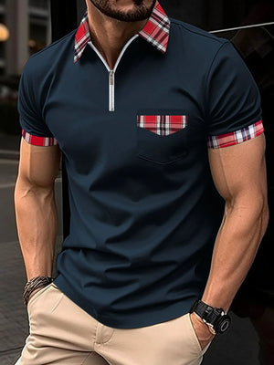 Navy zip polo shirt with plaid collar, pocket trim, and sleeve cuffs.