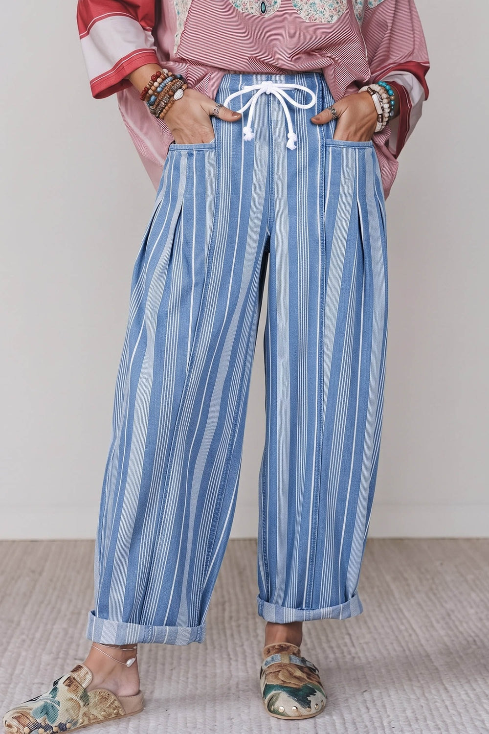 jeans in light blue featuring drawstring waist and wide-leg fit