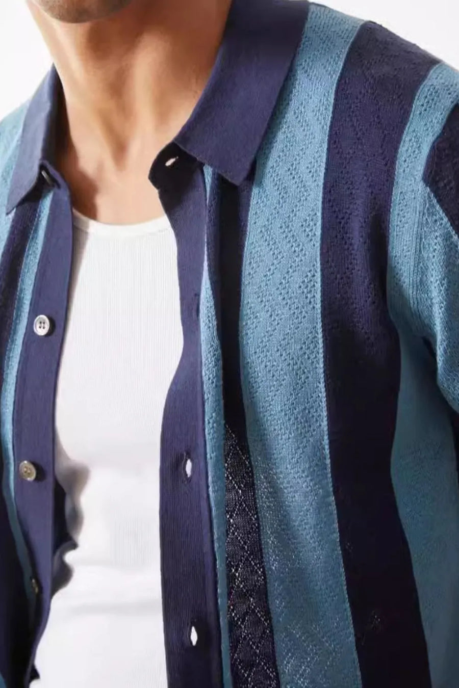 Men's navy and blue striped knit button-up shirt with a textured pattern.