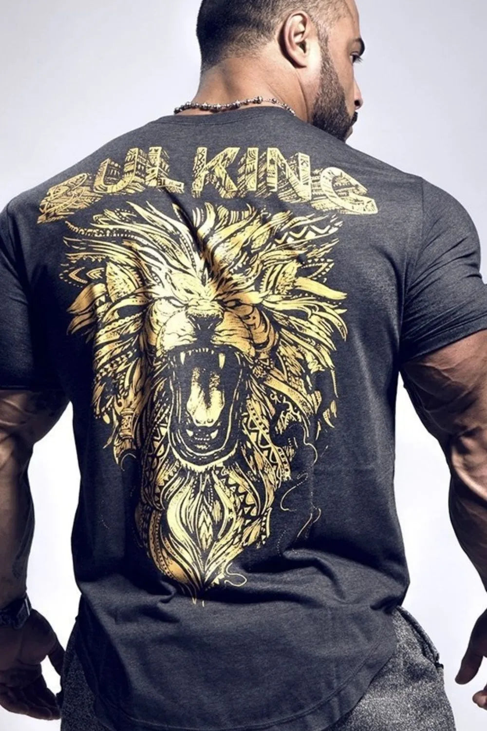 Dark gray t-shirt with gold roaring lion graphic and "BULKING KING" text on back