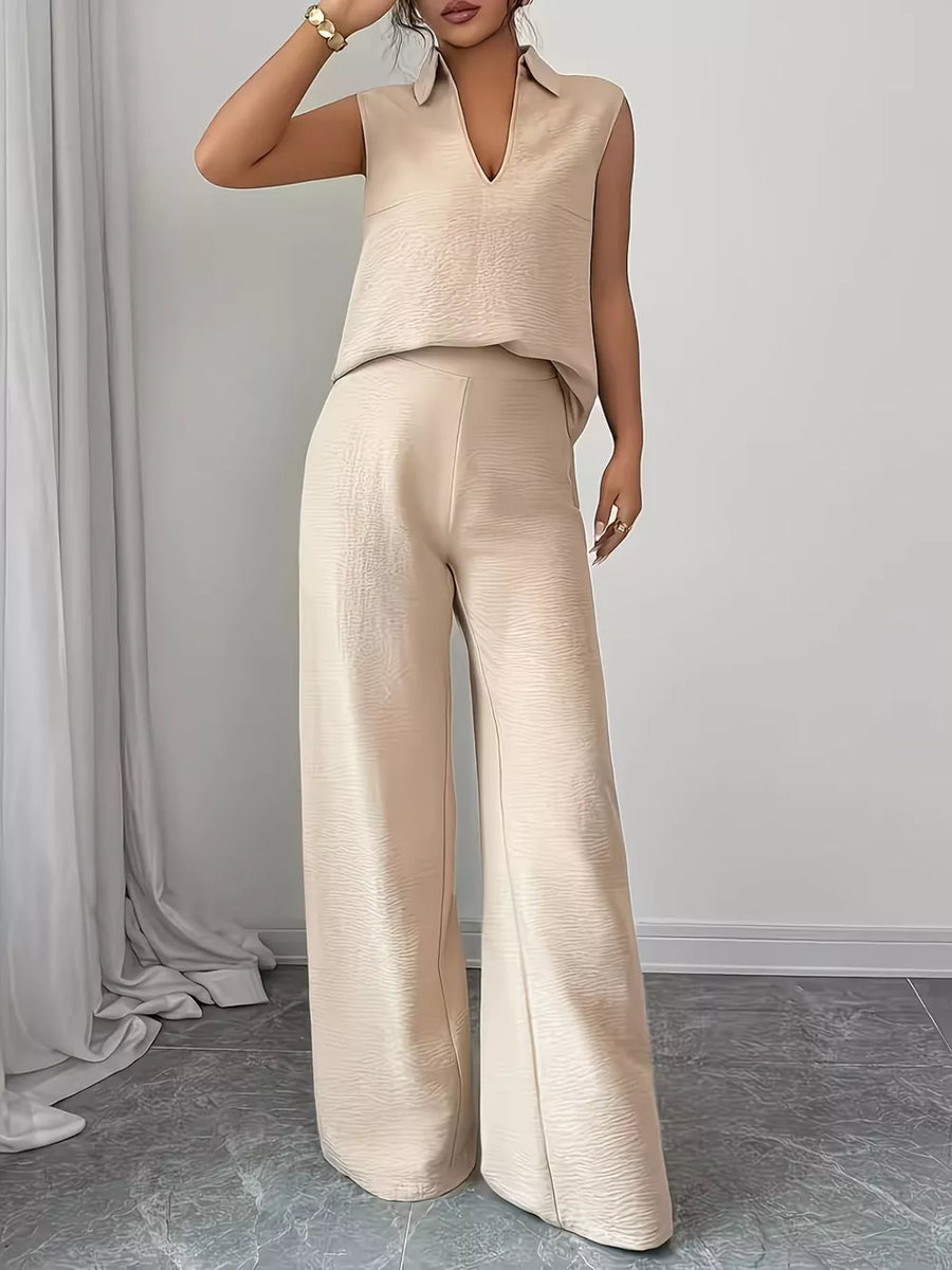 Beige sleeveless collared top and wide-leg pants set with textured fabric.